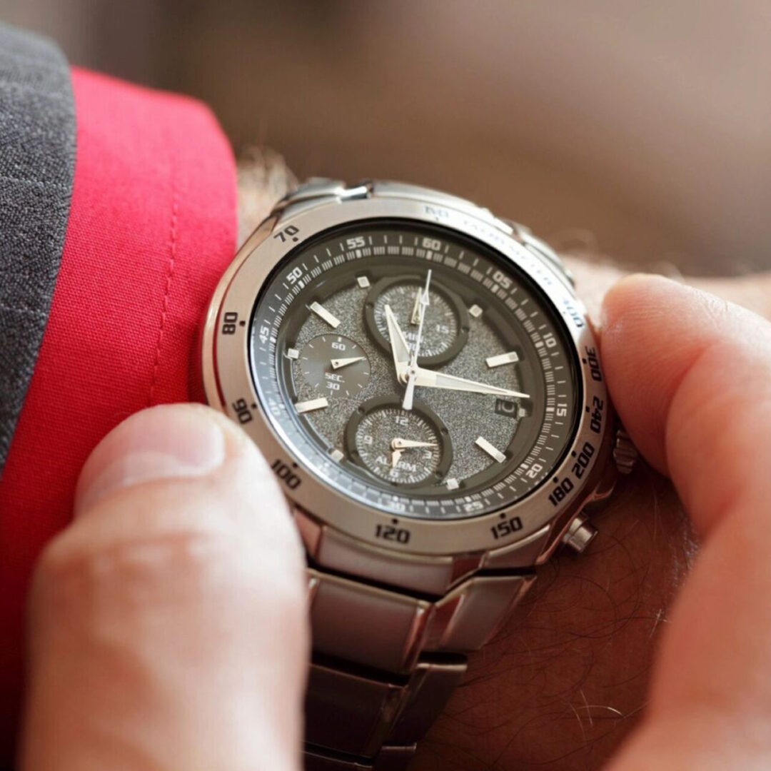 Close-up of a wristwatch on a person's wrist.